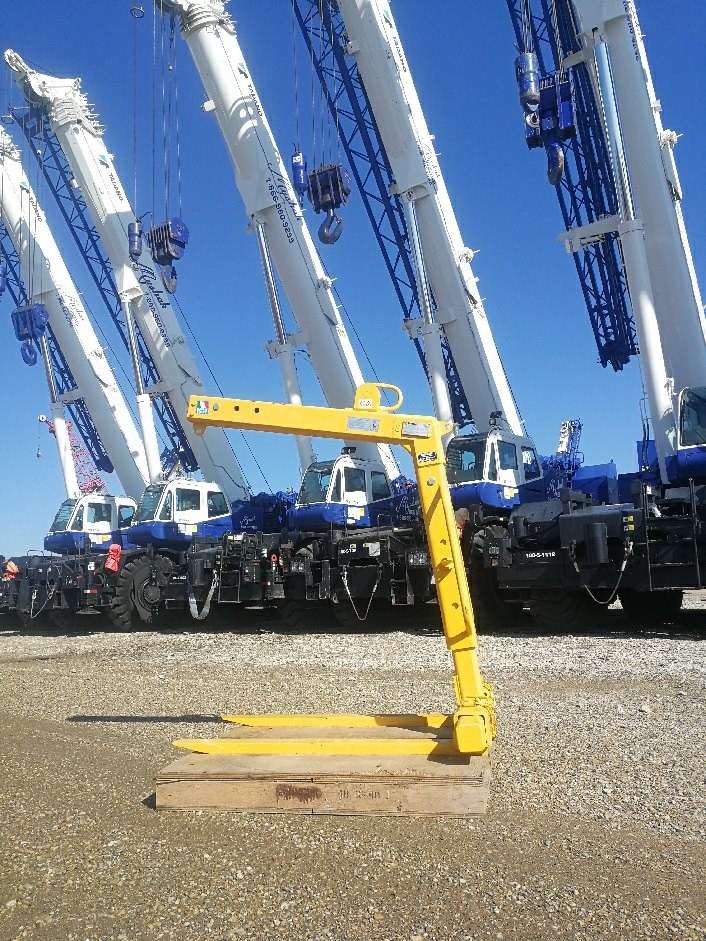 Crane pallet forks with cranes in background