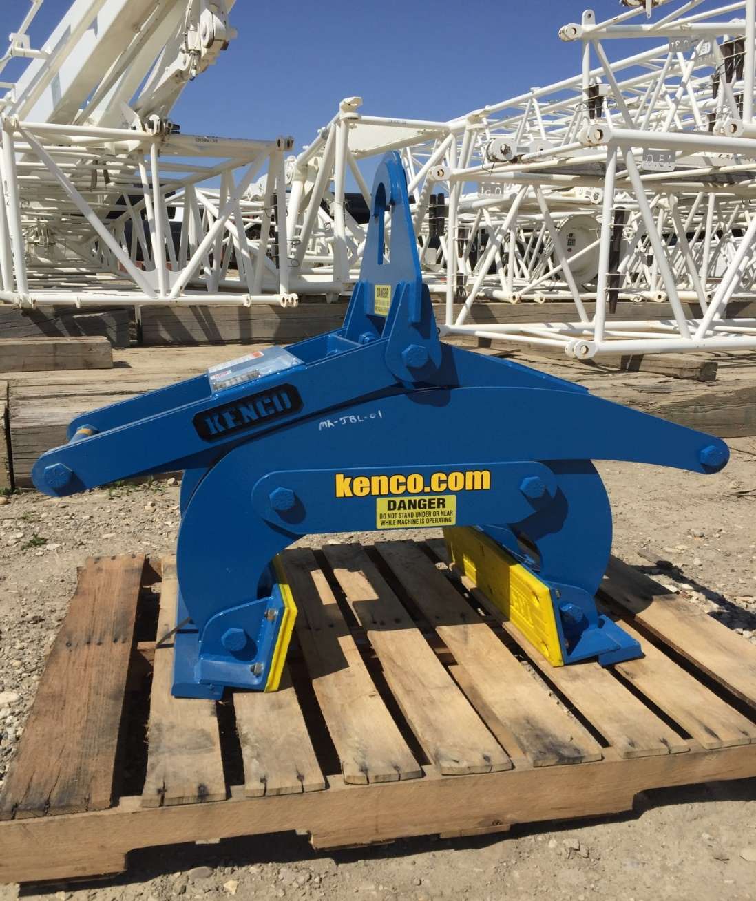 Blue Multi lift igging device with cranes in background